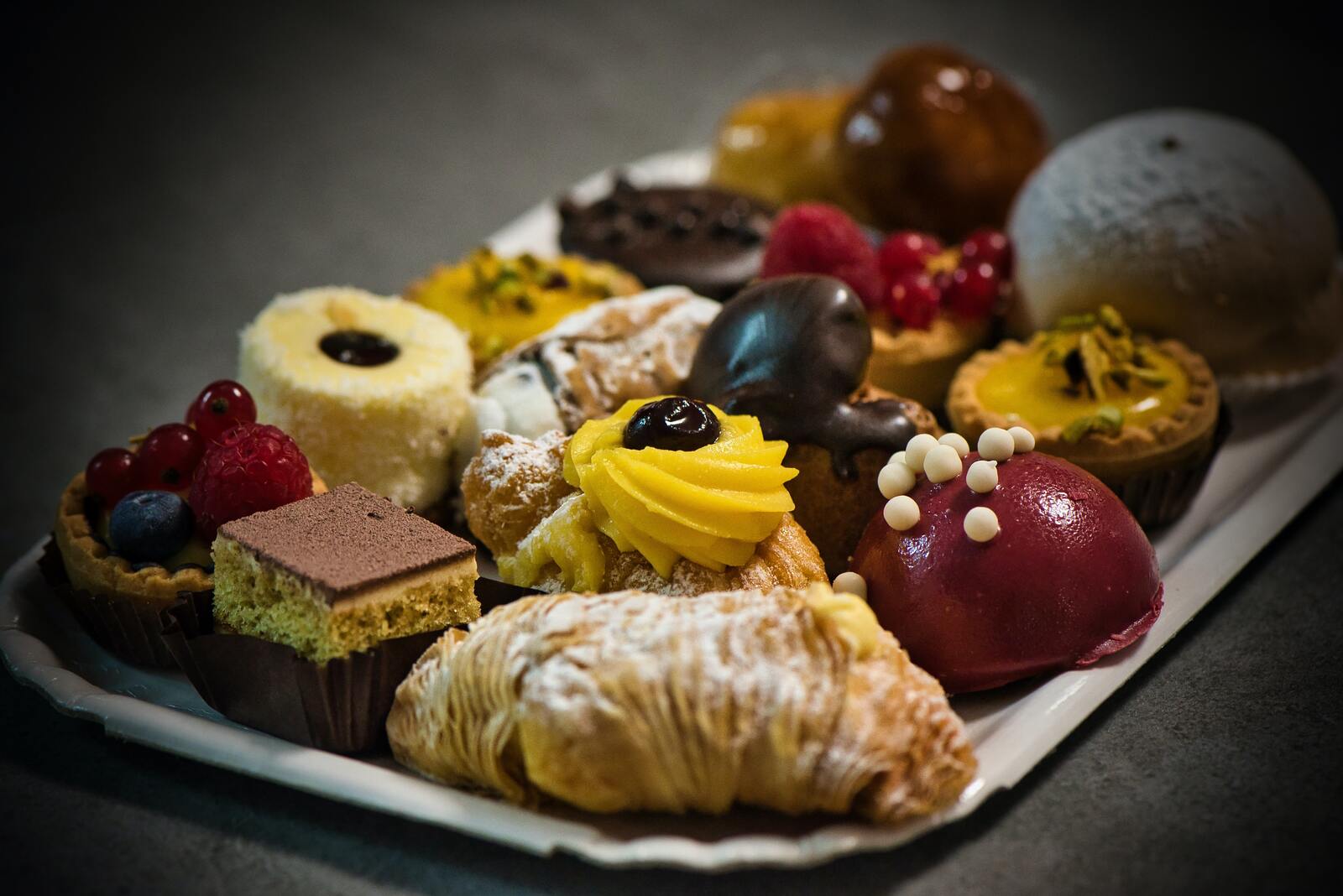 a tray with delicious italian cookies and cakes