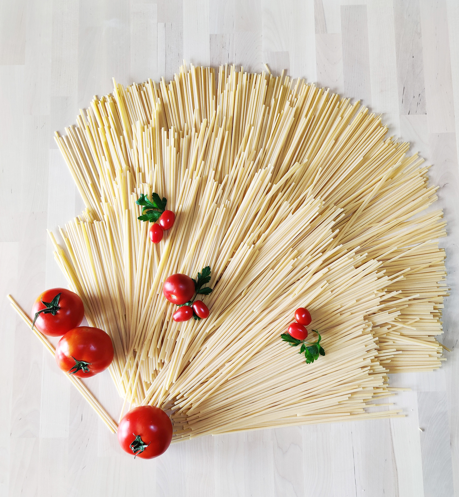 italian dry spaghetti decorated with cherry tomatoes
